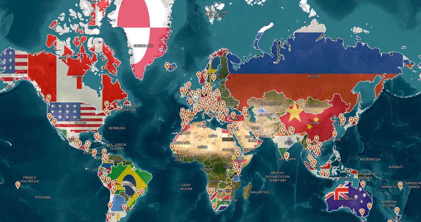 Emily's TripProf atlas: a satellite world map with every country she has visited filled with its flag, and a pin on every city