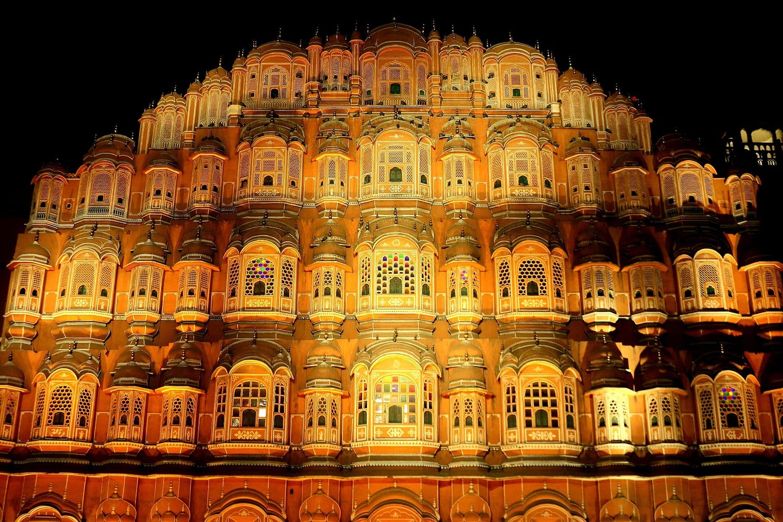 Jaipur's Hawa Mahal lit at night in the Pink City's old quarter
