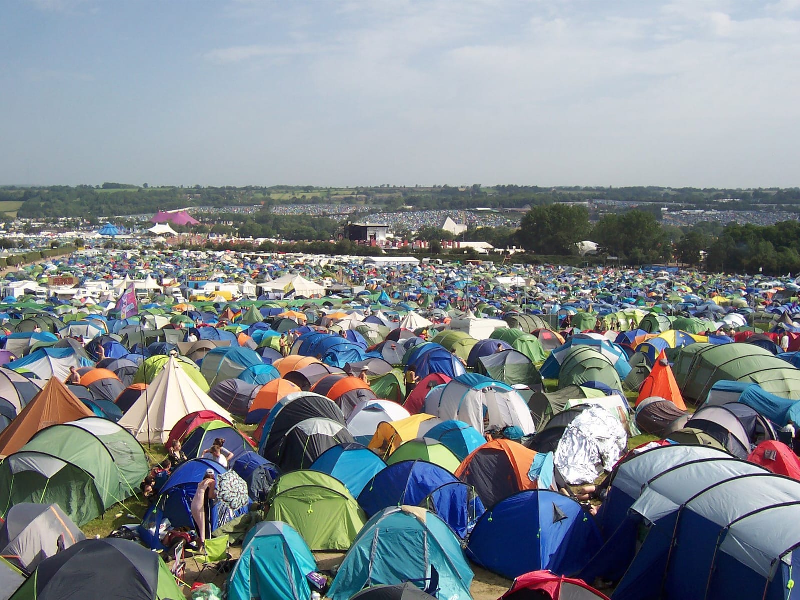 Tents covering the hillside camping fields above Glastonbury Festival's stages in 2019