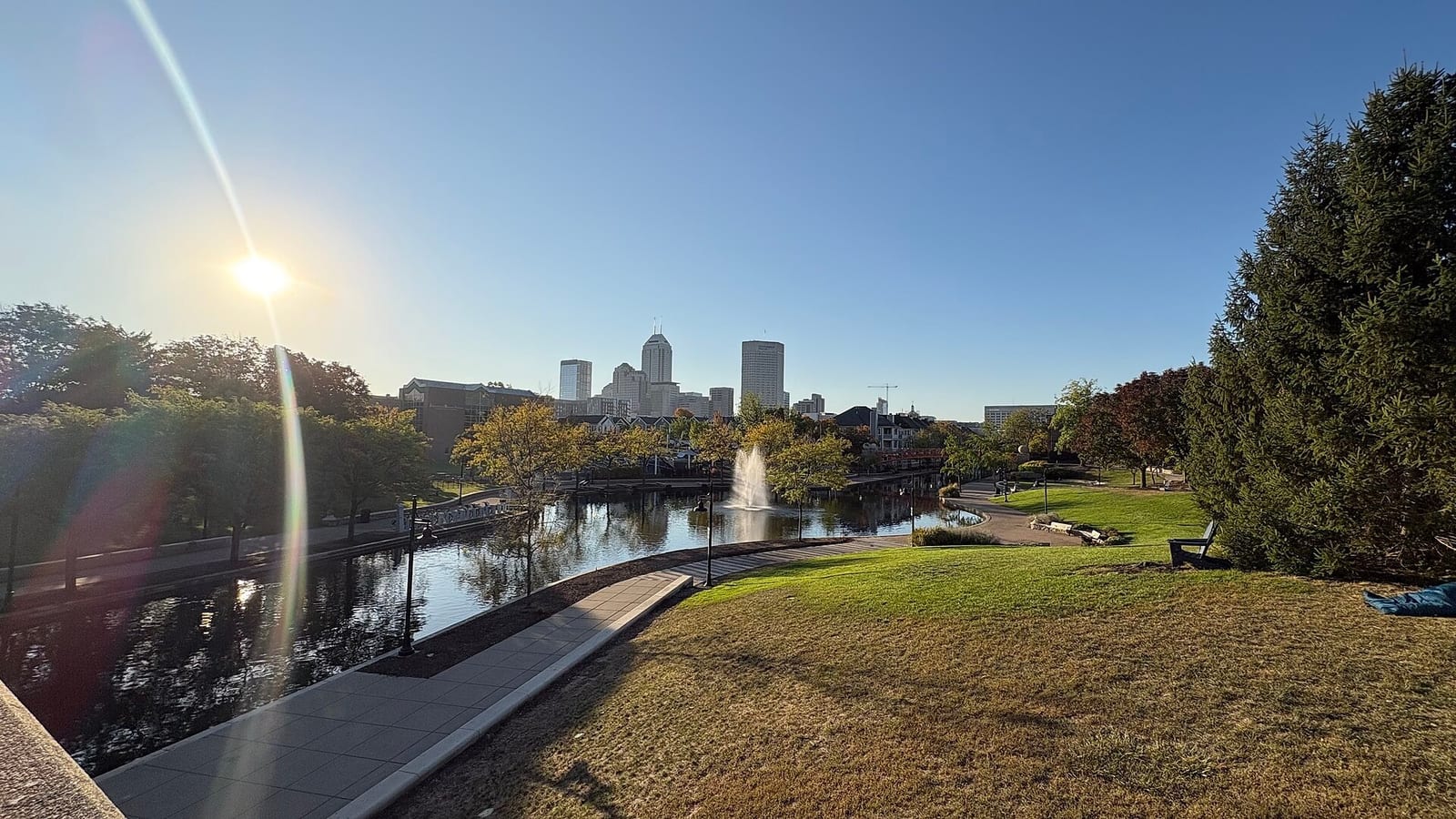 Indianapolis's downtown skyline reflects in the calm water of the Canal Walk.