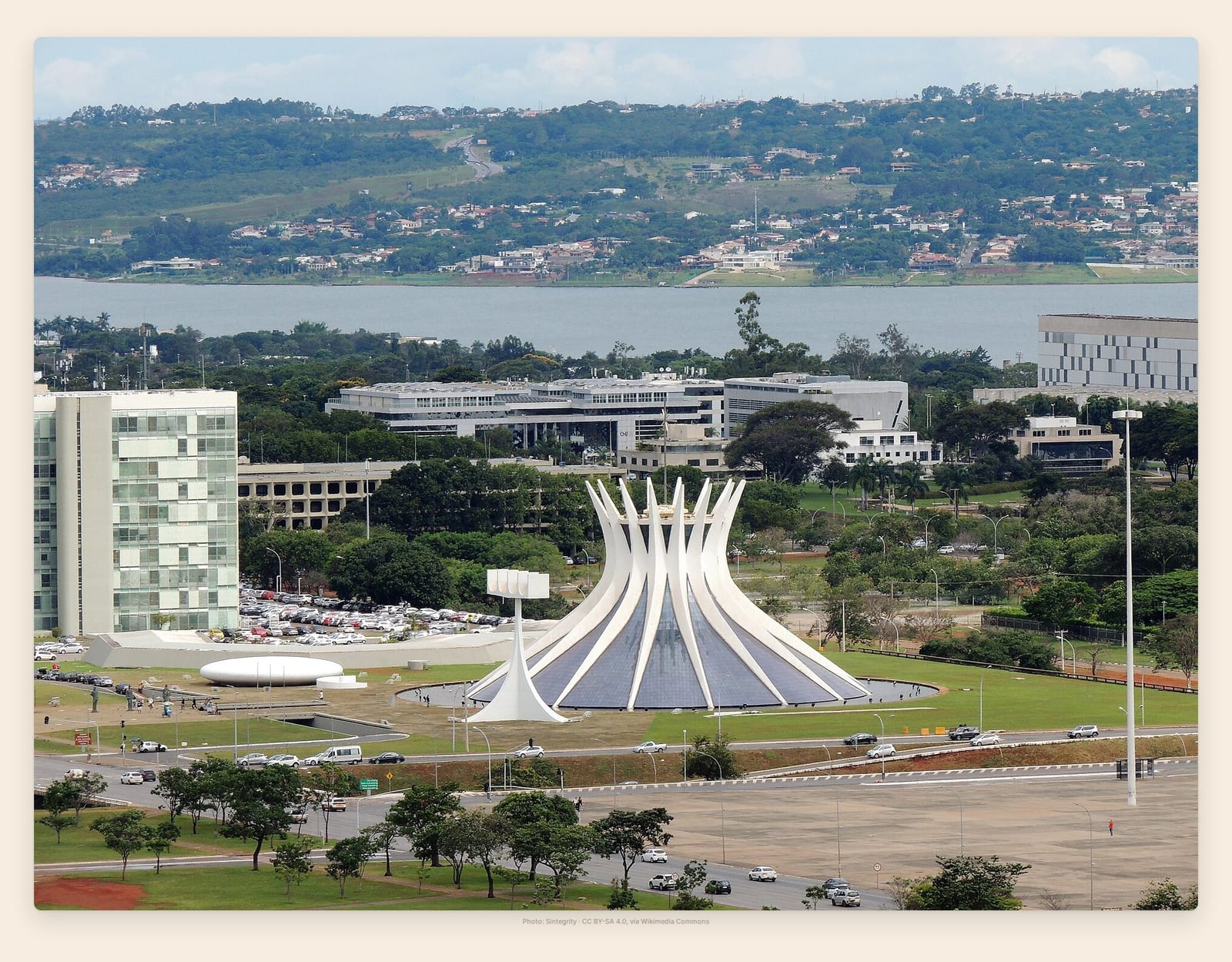 Brasilia's crown-shaped cathedral of white concrete ribs rises from a plaza framed by modernist towers