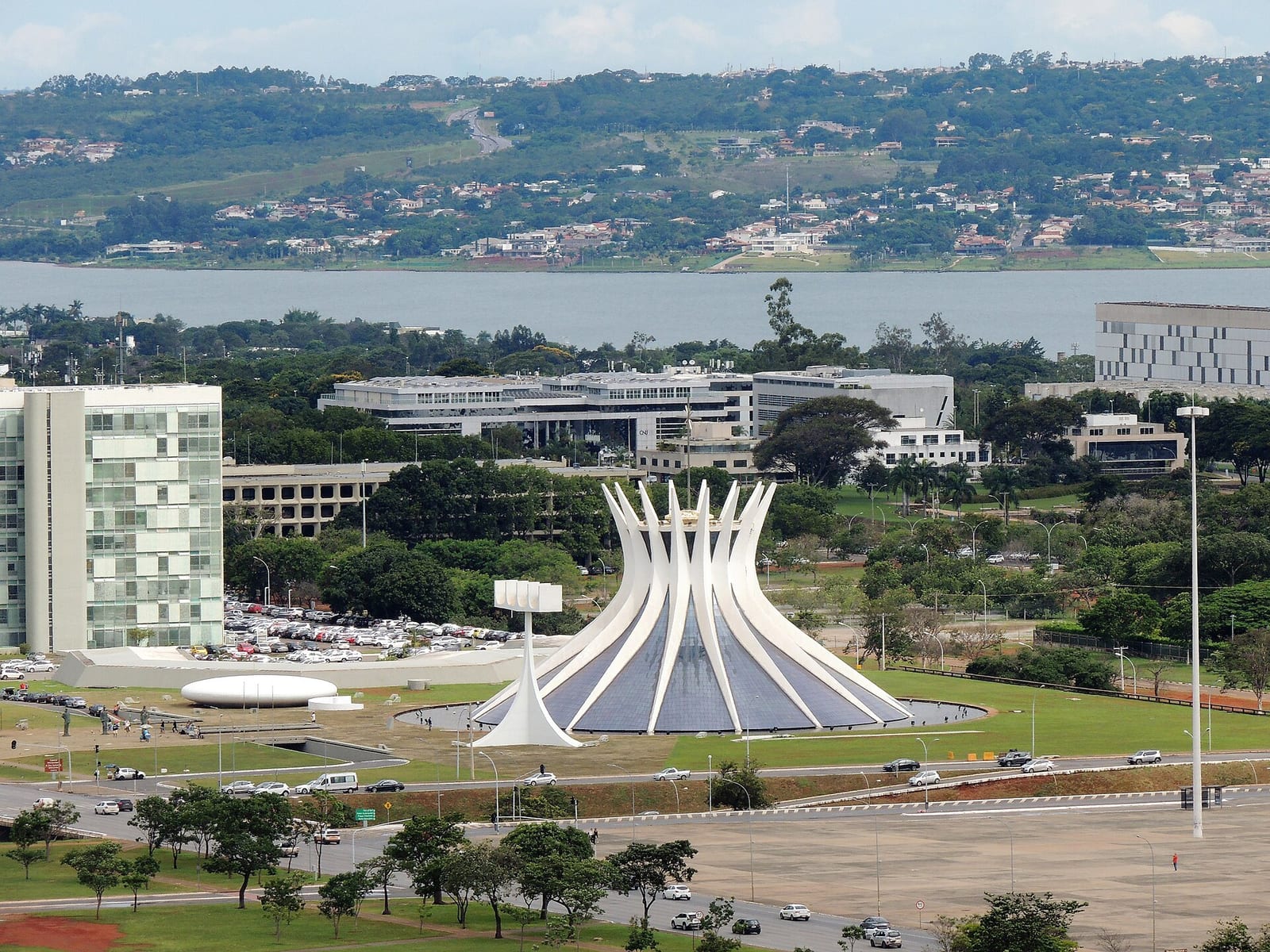 Brasilia's crown-shaped cathedral of white concrete ribs rises from a plaza framed by modernist towers