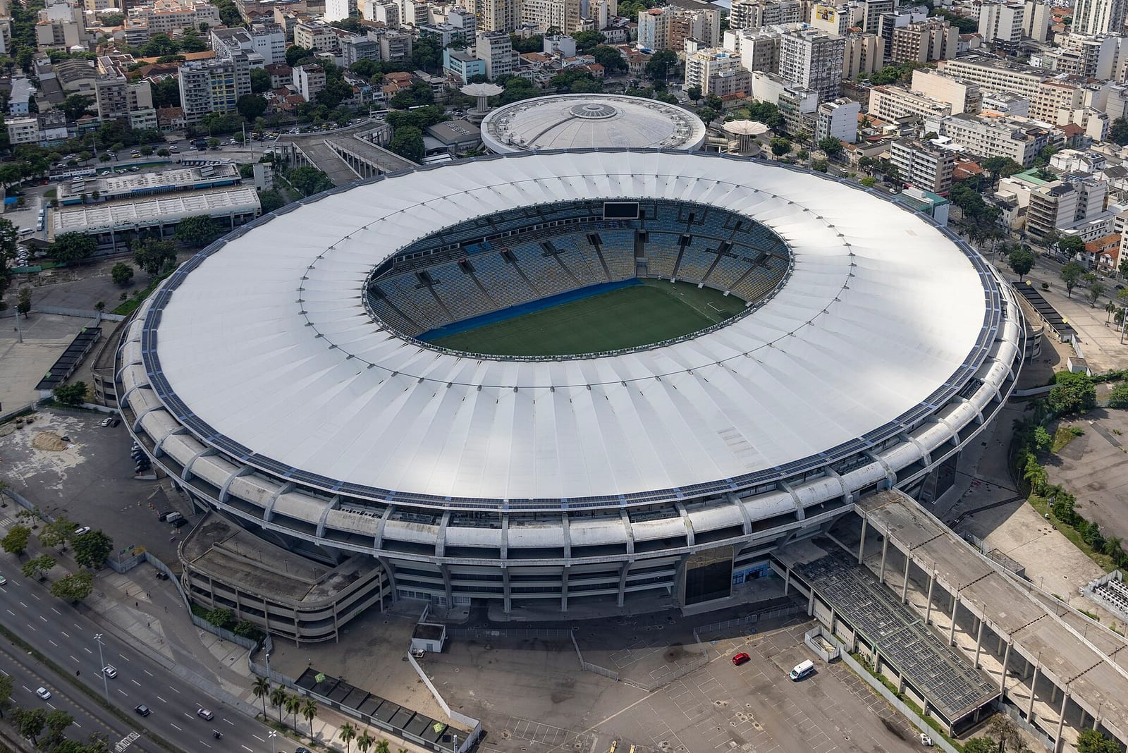 The Maracana's vast white ribbed roof and packed apartment blocks crowd in from every side of the bowl