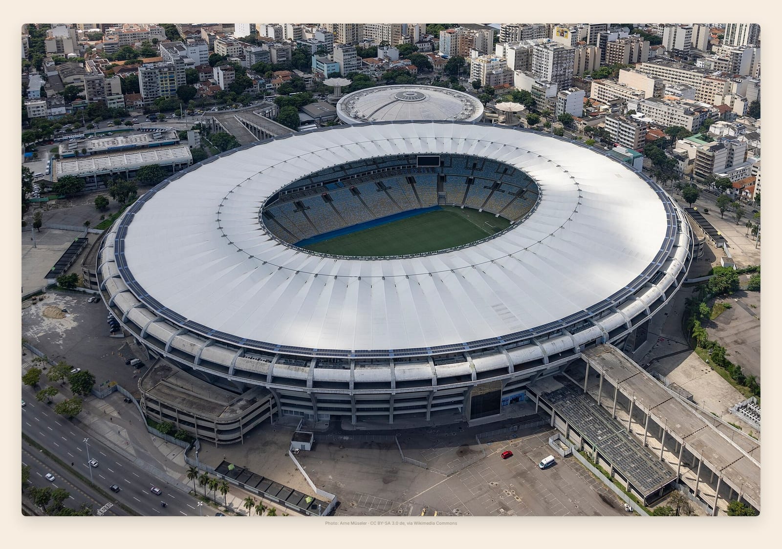 The Maracana's vast white ribbed roof and packed apartment blocks crowd in from every side of the bowl