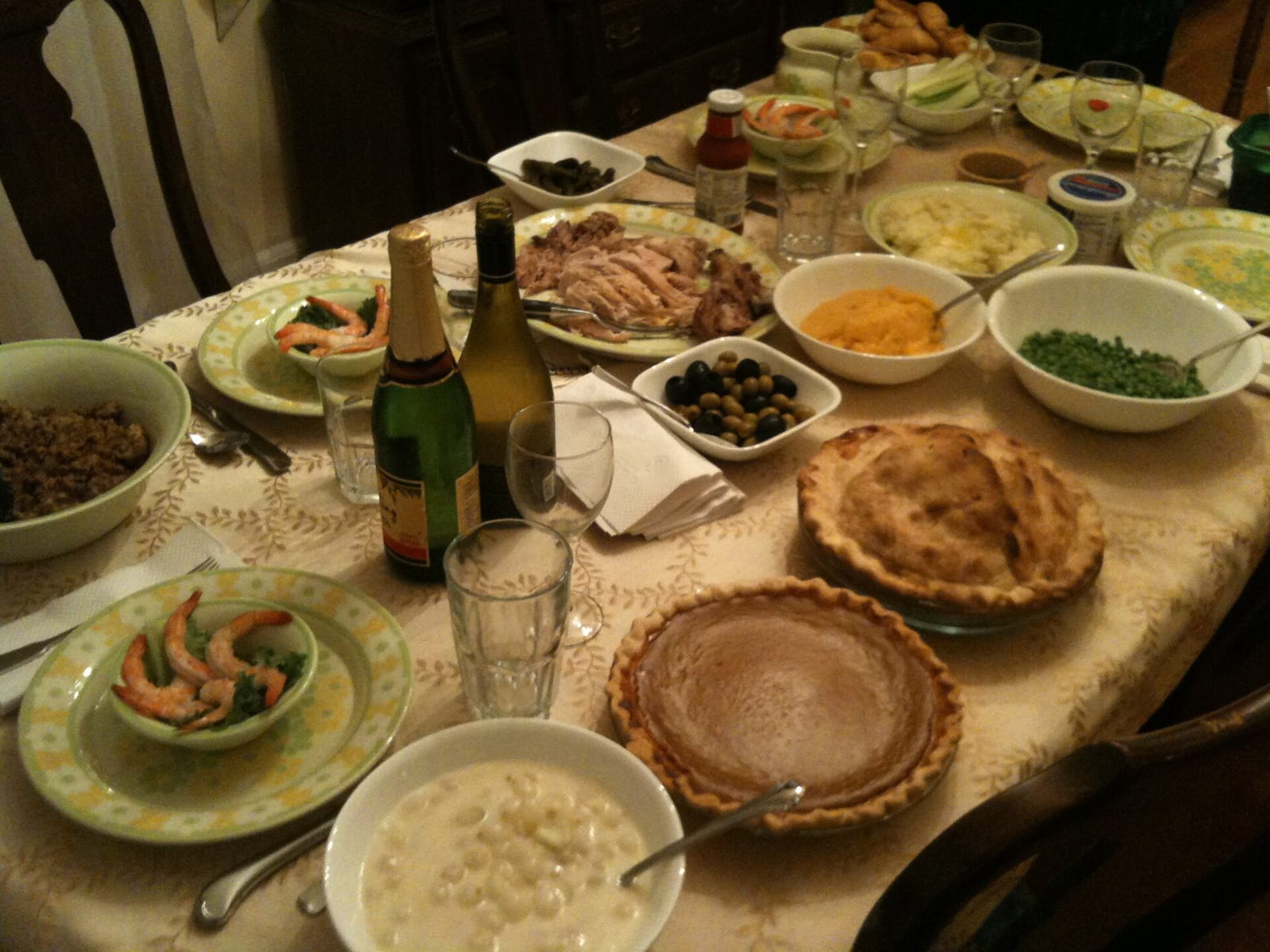 A Thanksgiving dinner table set with turkey, sides, and drinks for a shared weekend.