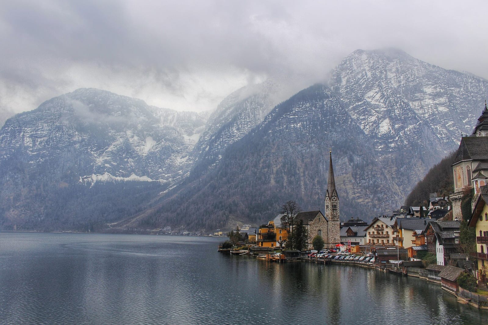 Hallstatt's lakeside houses stacked against the mountainside above the still water