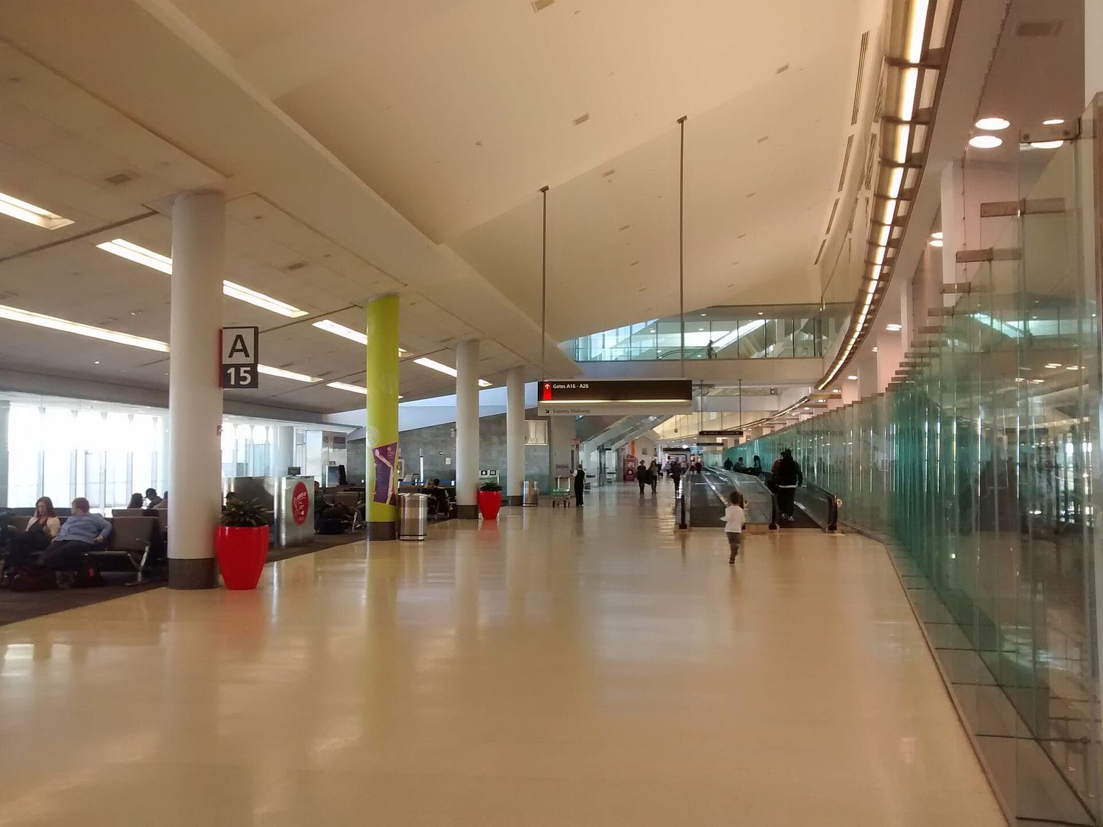 PHL's Terminal A concourse, with gate signage and a moving walkway toward the gates