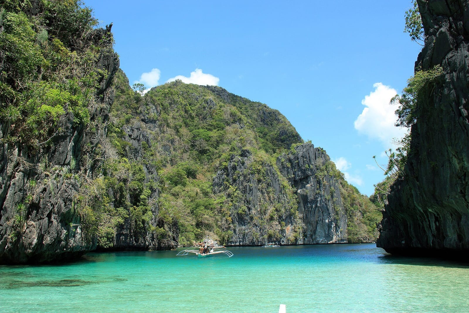 El Nido's Big Lagoon in Palawan, turquoise water ringed by limestone cliffs